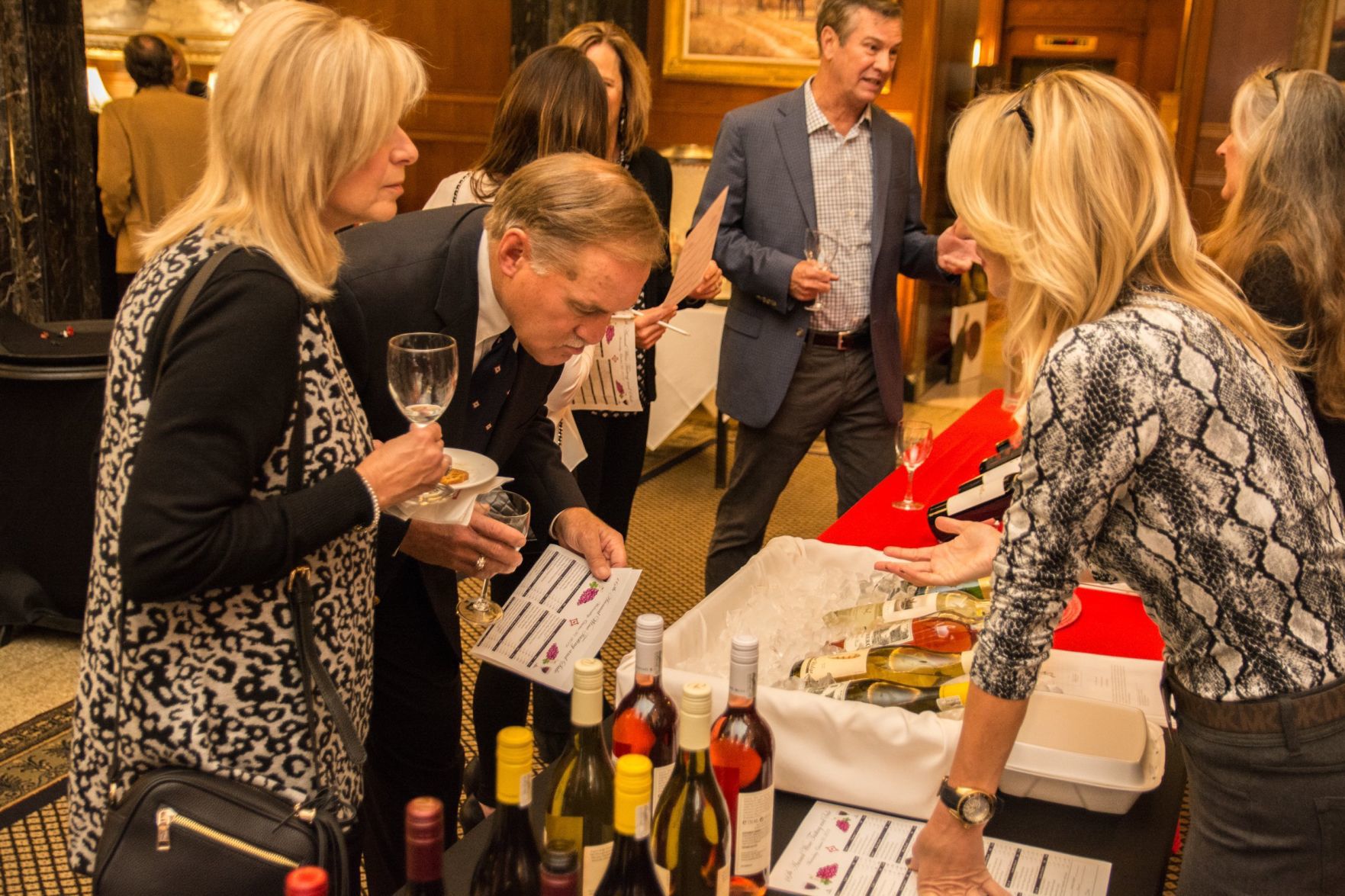 Attendees learn more about the wine